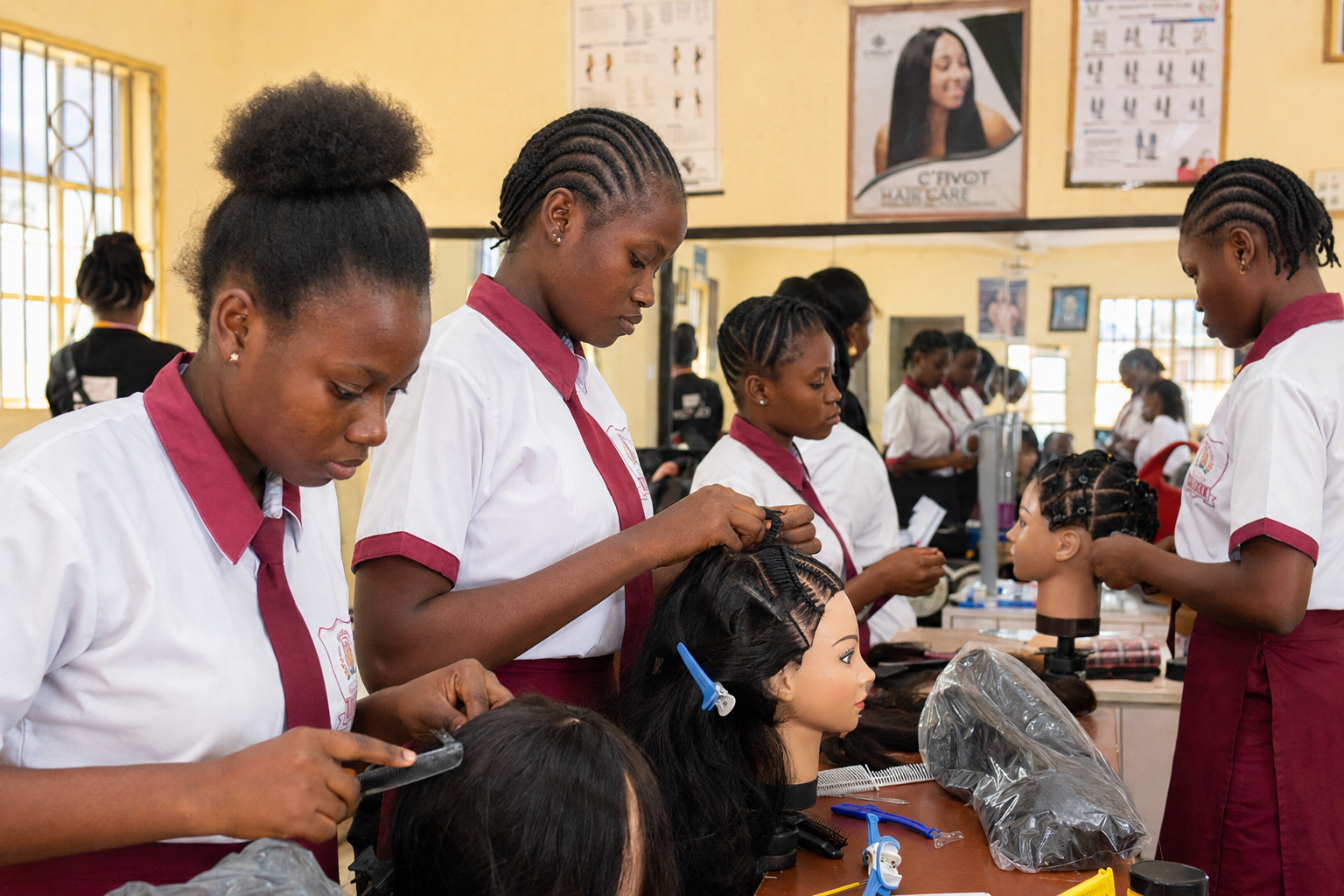 Students practicing hair styling on mannequin heads during a hair dressing vocational class